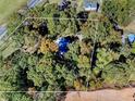 Overhead view of house nestled in a wooded lot at 3530 Dahlonega Hwy, Cumming, GA 30028
