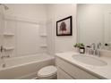 Clean bathroom showcasing a tub with shower, white vanity, and neutral decor for a soothing aesthetic at 1995 Deco Dr, Kennesaw, GA 30144