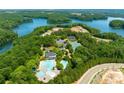 An aerial view showcasing the community pool, tennis courts, and lake access at 306 Mountain Laurel Walk, Canton, GA 30114