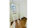 Inviting foyer with a view of the front door and living spaces, showcasing an elegant light fixture at 306 Mountain Laurel Walk, Canton, GA 30114