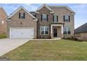 Brick two-story house with a large front yard at 916 Dexter Dr, Stockbridge, GA 30281