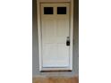 Newly painted white front door with updated hardware at 130 Taunton Rd, Covington, GA 30014