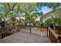 Inviting back deck perfect for relaxing and potted plants for added greenery at 1127 Riverbend Club Se Dr, Atlanta, GA 30339