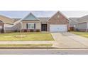 Charming one-story home featuring brick and siding exterior, manicured lawn and a two car garage at 4444 Kendrick Cir, Loganville, GA 30052