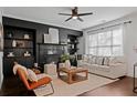 Living room with fireplace and built in shelving at 7470 Flintlock Way, Alpharetta, GA 30005