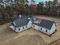 Aerial view of a house showing a large backyard and detached garage at 2259 County Line Rd, Acworth, GA 30101