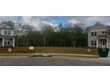 New home construction showing lot, street, and neighboring homes at 6060 Spring Way, Stonecrest, GA 30038