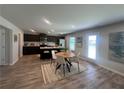 Bright kitchen and dining area with stainless steel appliances, breakfast bar, and a cozy dining table at 3290 Forest Green Dr, Douglasville, GA 30135
