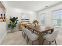 Spacious dining room with modern table, chairs, stylish décor, and natural light at 2500 Peachtree Nw Rd # 405S, Atlanta, GA 30305