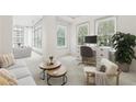 Comfortable living area with cozy seating, a work area, and bright natural light at 2500 Peachtree Nw Rd # 405S, Atlanta, GA 30305