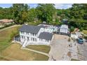Charming two-story home with a driveway, rear parking, and a lovely pool area at 3636 Evans Rd, Atlanta, GA 30340