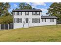 Beautifully renovated two-story home with classic shutters and landscaped lawn at 3636 Evans Rd, Atlanta, GA 30340