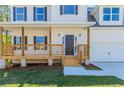 Inviting covered front porch with wood railings and a welcoming entrance to the home at 6462 Beaver Creek Trl, Atlanta, GA 30349