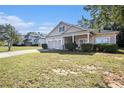 Charming single-Gathering home with a well-manicured lawn and attached two car garage at 421 Bedford Xing, Mcdonough, GA 30253