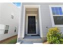Stylish front door with visible house number in front of a two-story gray home at 2688 Toucan Way, Atlanta, GA 30331