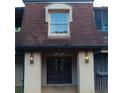 Exterior shot of unit with dark wood doors and cream colored siding and decorative lights at 3014 Parc Lorraine Cir # 3014, Lithonia, GA 30038