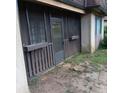 Rear screened porch showing private entrance, landscaping and outdoor patio area at 3014 Parc Lorraine Cir # 3014, Lithonia, GA 30038