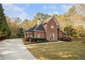 Two-story brick home with a large yard at 1418 Brighton Pl, Loganville, GA 30052