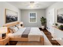 Bright main bedroom featuring natural light, hardwood floors, neutral paint and ample closet space at 9206 Carlton Nw Trl, Covington, GA 30014