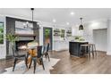 Bright living room with fireplace, wood floors, an island, and eat-in kitchen area at 2228 Old Dallas Sw Rd, Marietta, GA 30064