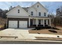 Charming two-story home with a stone facade and attached two-car garage at 337 Willow Cv, Canton, GA 30114