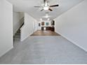 Open concept floor plan with living room, staircase, kitchen, and dining area, great for entertaining at 4001 Avalon Sw Rd, Atlanta, GA 30331