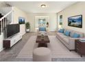 Bright living room features neutral decor, plush carpeting, and comfortable furnishings for a welcoming ambiance at 6260 Selborn Sw Dr, Atlanta, GA 30331