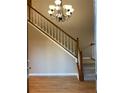 Grand entryway with hardwood floors, chandelier and staircase leading upstairs at 3370 Knighton Rdg, Powder Springs, GA 30127