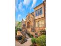 Charming home featuring a stone and brick facade, landscaped front yard and inviting entrance at 4853 Stonehall Pl, Atlanta, GA 30339