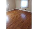 Bright bedroom featuring hardwood floors and a large window at 5094 Mable Lake Sw Dr, Mableton, GA 30126