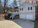 Two-story house with a gray exterior, two-car garage and a front yard at 194 Spring Leaf Dr, Dallas, GA 30157