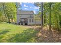 Gray house with stone accents, deck, and lush landscaping at 7445 Talbot, Sandy Springs, GA 30328