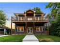 Charming two-story home with double balconies, beautiful landscaping, and a welcoming entrance at 971 Washington Sw Pl, Atlanta, GA 30314