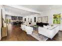 Spacious living room featuring hardwood floors, neutral paint, and an open floorplan to the kitchen at 971 Washington Sw Pl, Atlanta, GA 30314