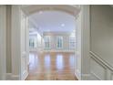 Elegant living room with hardwood floors, white trim, and arched doorways at 3707 Peachtree Ne Rd # 1, Atlanta, GA 30319