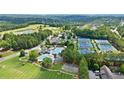 Aerial shot showcasing community amenities including pools, tennis courts, and green spaces at 8150 Albritton Downs, Cumming, GA 30041