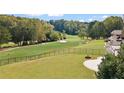 Spacious backyard with a fire pit and views of the golf course at 8150 Albritton Downs, Cumming, GA 30041