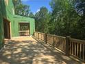 New wooden deck overlooking wooded area on a house still under construction at 170 Cedarwood Ln, Roswell, GA 30075
