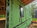 A new home under construction with window framing and weatherboard protection at 170 Cedarwood Ln, Roswell, GA 30075