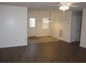 Bright living room featuring wood-look flooring and a ceiling fan at 434 Spring Leaf Dr, Dallas, GA 30157