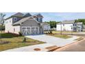 Two-story home with a two-car garage, covered front entry, and sidewalk at 1857 Holmsey Cir, Conyers, GA 30094