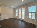 Spacious dining area with hardwood floors and access to a deck at 4326 Water Elm Aly, Doraville, GA 30360