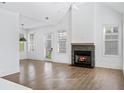 Spacious living room featuring hardwood floors and fireplace at 377 Anders N, Chattahoochee Hills, GA 30268