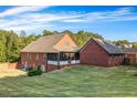 Brick home with screened porch and large backyard at 1231 Bent Creek Dr, Mcdonough, GA 30252