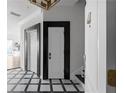 Elegant entryway with black and white checkered floor at 3475 Oak Valley Rd # 2820, Atlanta, GA 30326