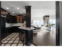 Modern kitchen with dark cabinetry and quartz counters at 3475 Oak Valley Rd # 2820, Atlanta, GA 30326