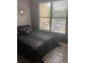 Comfortable bedroom with a queen-size bed and large windows at 870 Mayson Turner Nw Rd # 1102, Atlanta, GA 30314