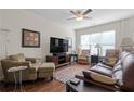 Inviting living room with hardwood floors, a ceiling fan, and plenty of natural light at 1801 Liberty Nw Pkwy, Atlanta, GA 30318