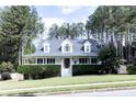 Charming single Gathering home boasts mature trees and pristine landscaping at 295 Whitby Dr, Douglasville, GA 30134