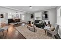Open concept living room with hardwood floors, natural light, and seamless transition to the dining area at 1331 Walker Ave, Atlanta, GA 30344